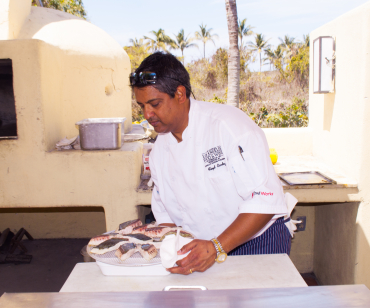 Cardoz cooking fish in Mexico at the Punta Mita Gourmet and Golf Challenge Jacqueline Raposo